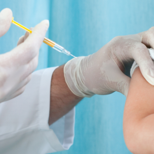 Doctor giving a vaccine to a child