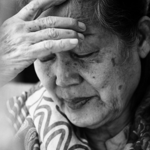 Elderly Asian-American woman in distress