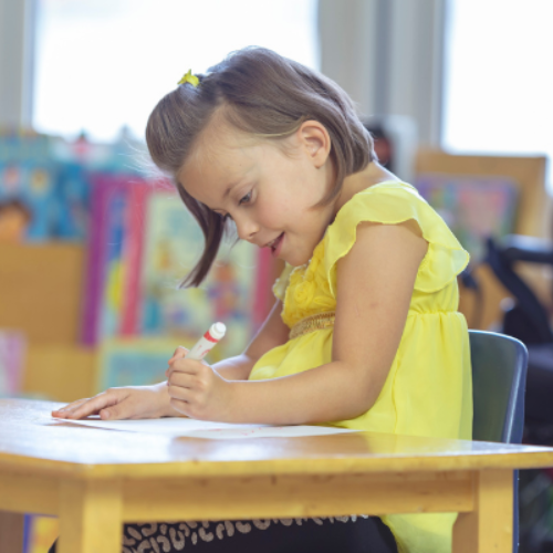 Young child practicing writing