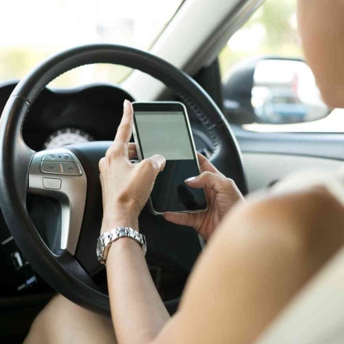 Woman texting while driving