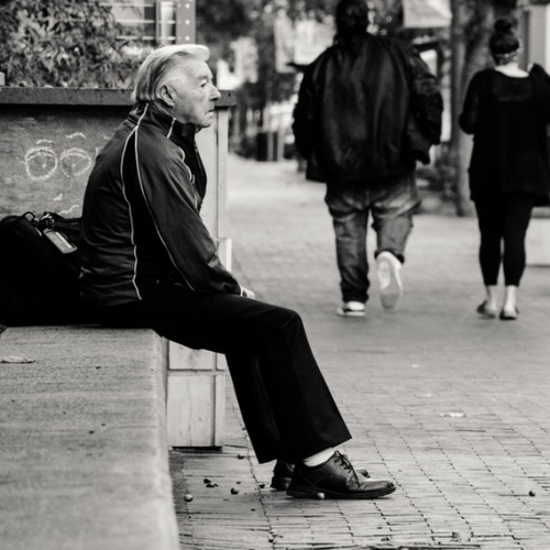 Man sitting alone on bench