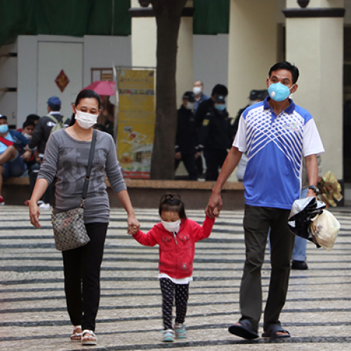 A family wearing masks