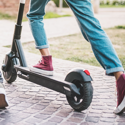 Someone riding an e-scooter