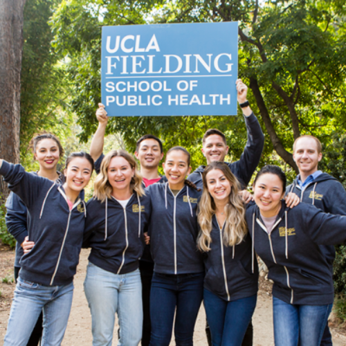Students holding up a sign that says UCLA FSPH