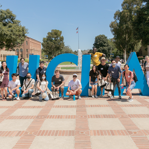 students in front of UCLA letters