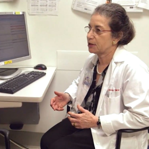 Patricia Ganz talking with patient