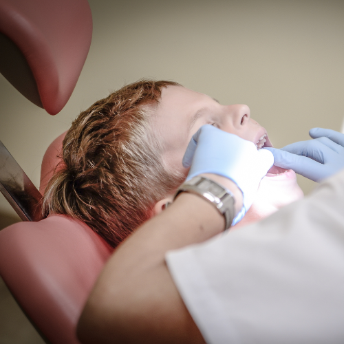 Child with dentist getting checkup