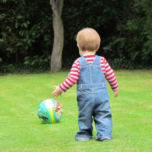 Child playing on grass