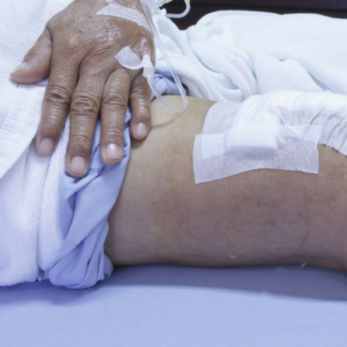 knee surgery patient on hospital bed