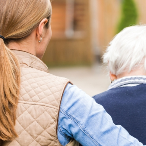 woman comforting an elderly man