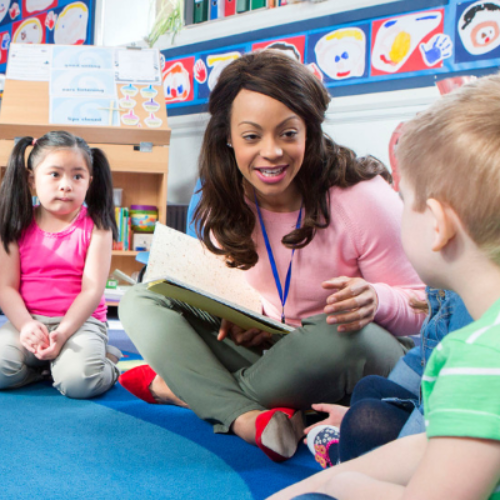 teacher talking with students