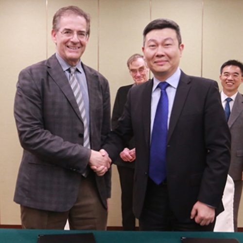 Dean Ron Brookmeyer shaking hands with Yuantao Hao