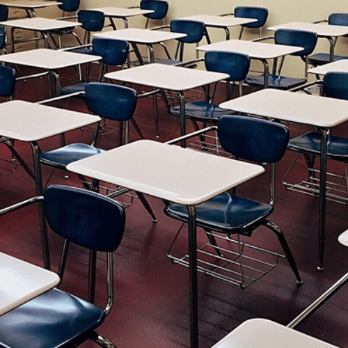 empty classroom with desks and chairs