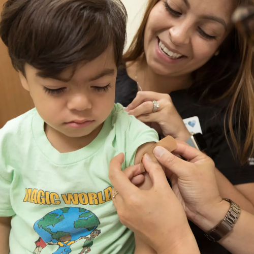 doctors bandaging a child