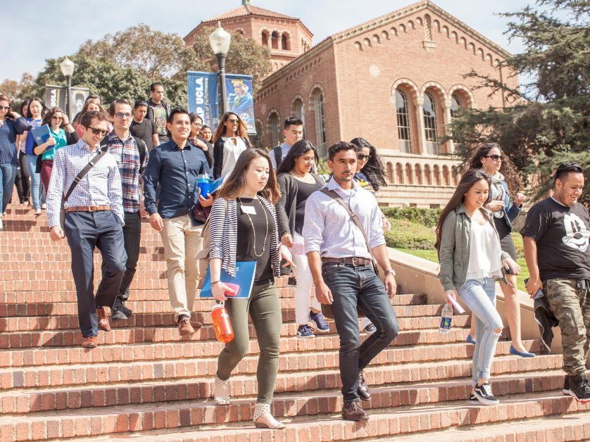 students walking down stairs on campus