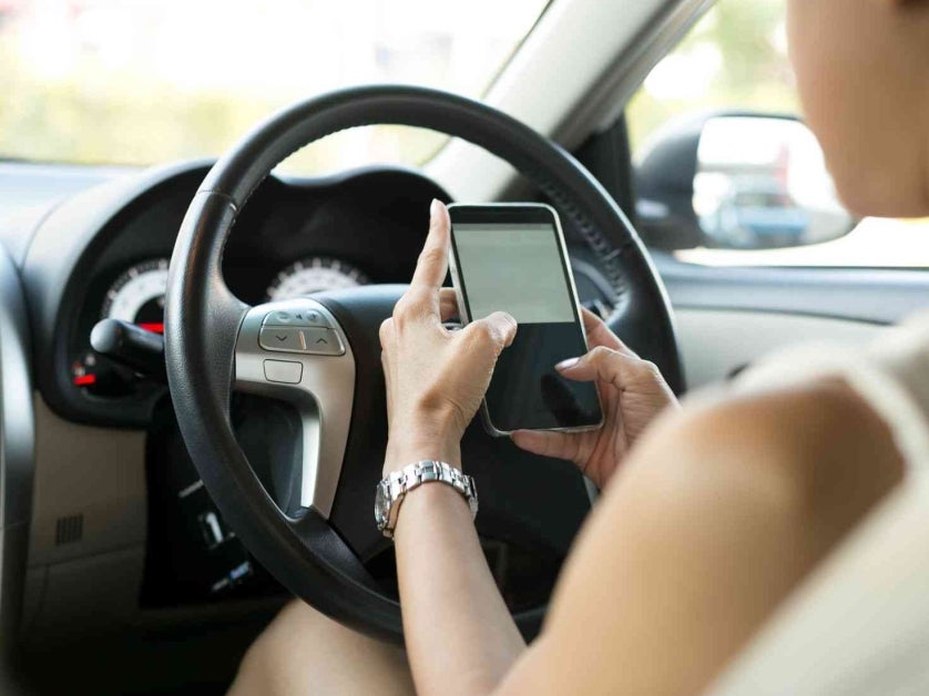 Woman texting while driving