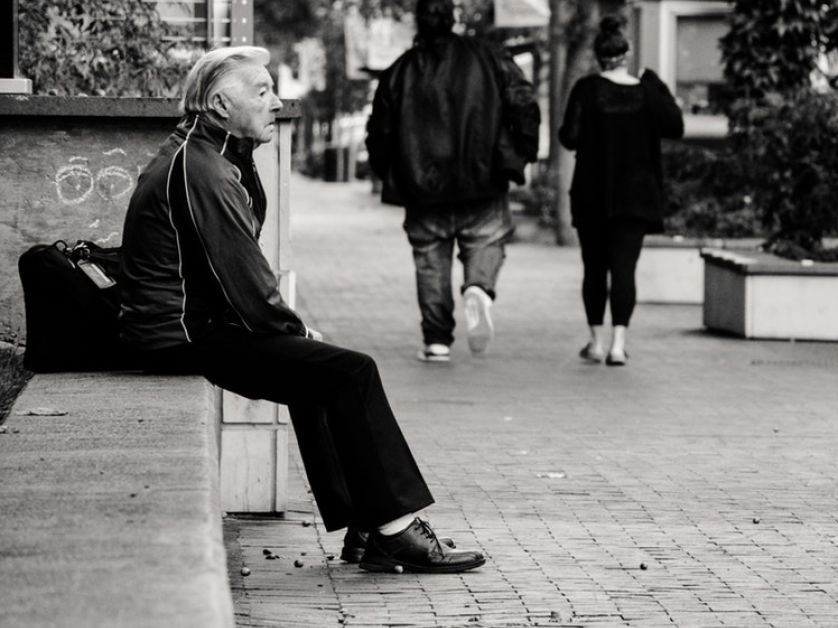 Man sitting alone on bench