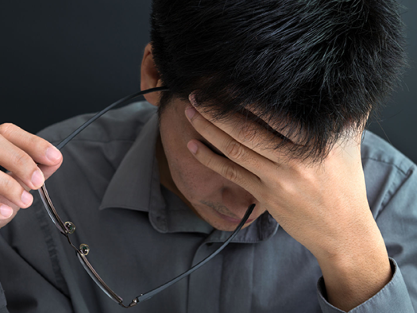 Man falling asleep at his desk