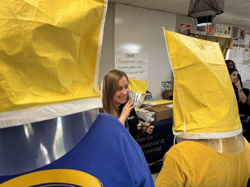 UCLA Fielding staff training workers one safe use of protective equipment in the aftermath of the 20125 Los Angeles County fires.