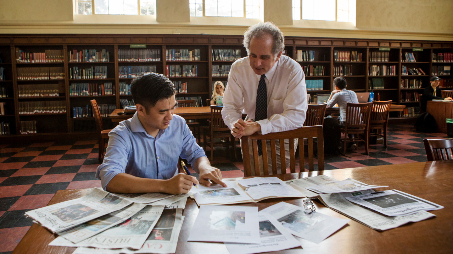 student and professor discussing research