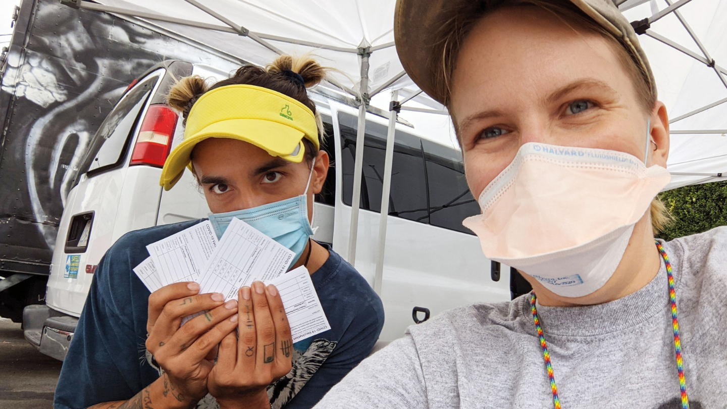 Dr. Chelsea Shover (right) with Gunner Sixx, a coordinator with Housing for Health, at a vaccination event at St. Francis Center in Downtown Los Angeles in August 2021.