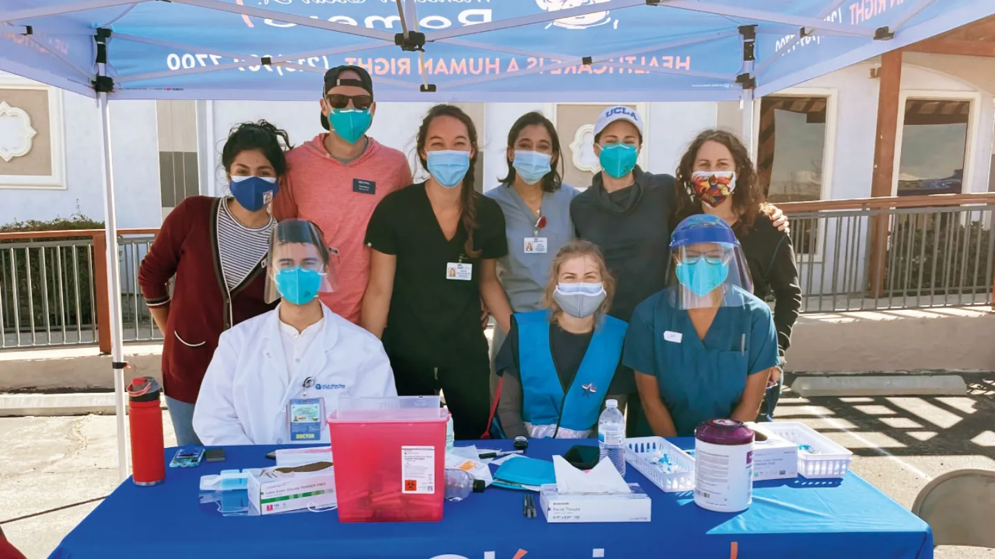 At the UCLA-supported pop-up clinic fo farmworkers in Palmdale, California, hosted by Clinica Romero, seated, L. to R.: Dr. Oscar E. Gallardo Huizar, Olive View-UCLA Internal Medicine resident, Becca Nelson, UCLA undergraduate, Janell Moore (MPH ’14), FSPH staff; standing, L. to R.: Edith Hernandez (MPH ’15), then public health manager for Clinica Romero; H. Travis Moore, student at UCLA Anderson School of Management; Dr. Kristen Choi, faculty member in FSPH and the UCLA School of Nursing; Dr. Pooja Desai,