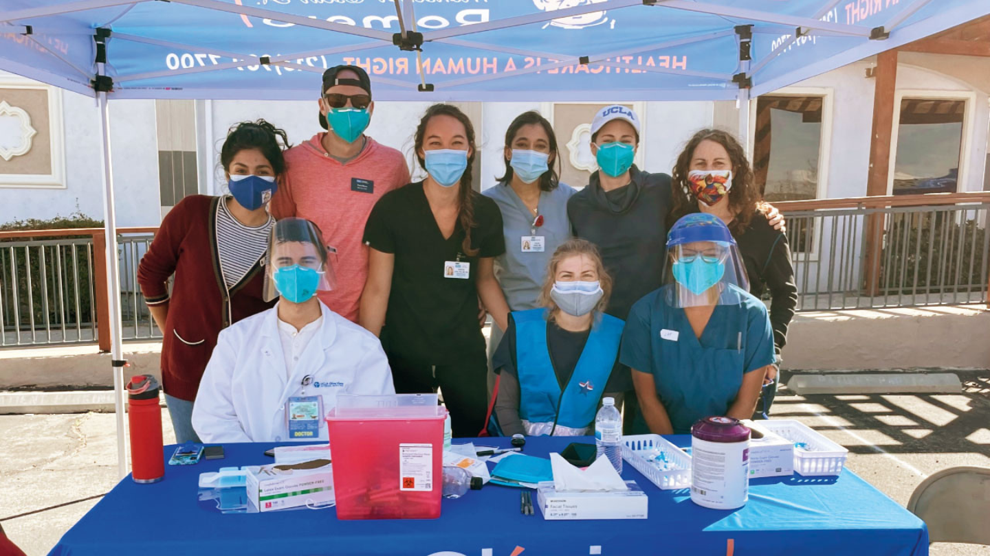 At the UCLA-supported pop-up clinic fo farmworkers in Palmdale, California, hosted by Clinica Romero, seated, L. to R.: Dr. Oscar E. Gallardo Huizar, Olive View-UCLA Internal Medicine resident, Becca Nelson, UCLA undergraduate, Janell Moore (MPH ’14), FSPH staff; standing, L. to R.: Edith Hernandez (MPH ’15), then public health manager for Clinica Romero; H. Travis Moore, student at UCLA Anderson School of Management; Dr. Kristen Choi, faculty member in FSPH and the UCLA School of Nursing; Dr. Pooja Desai, 