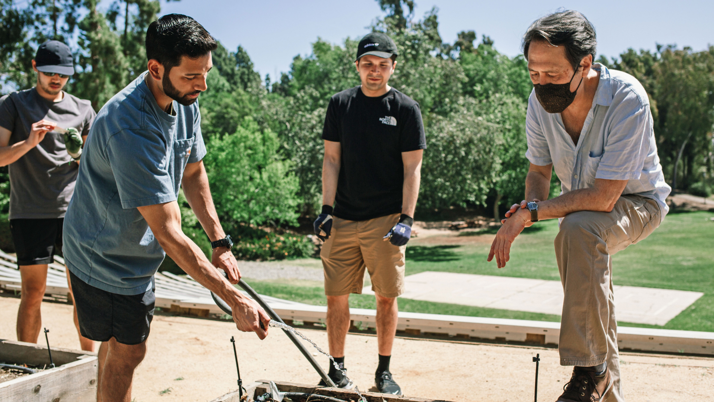 Three men gardening