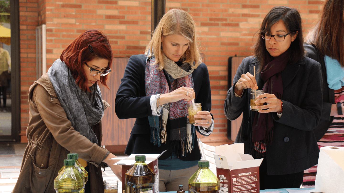 Three women making their own health products during Tox it Out Seminar