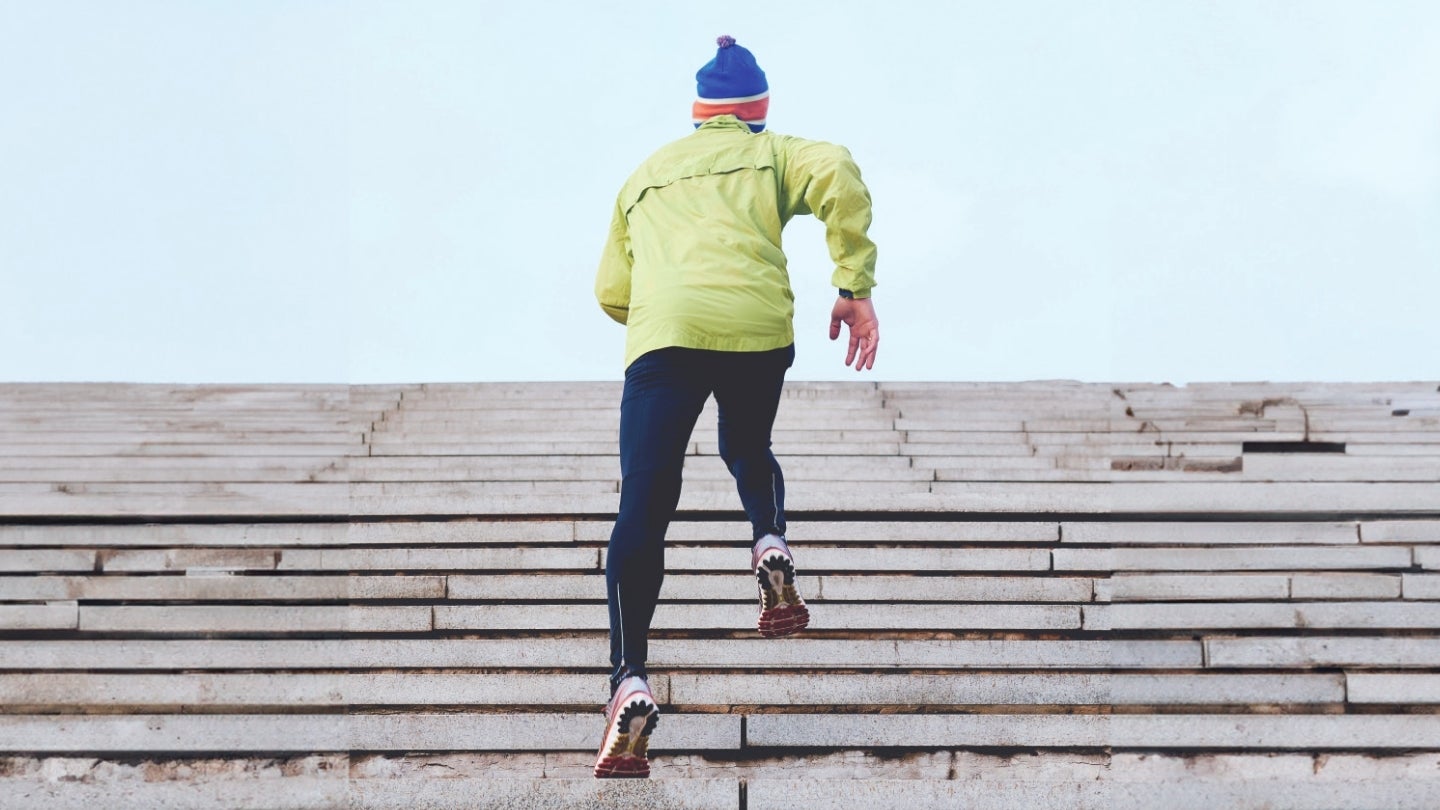 man running up stairs